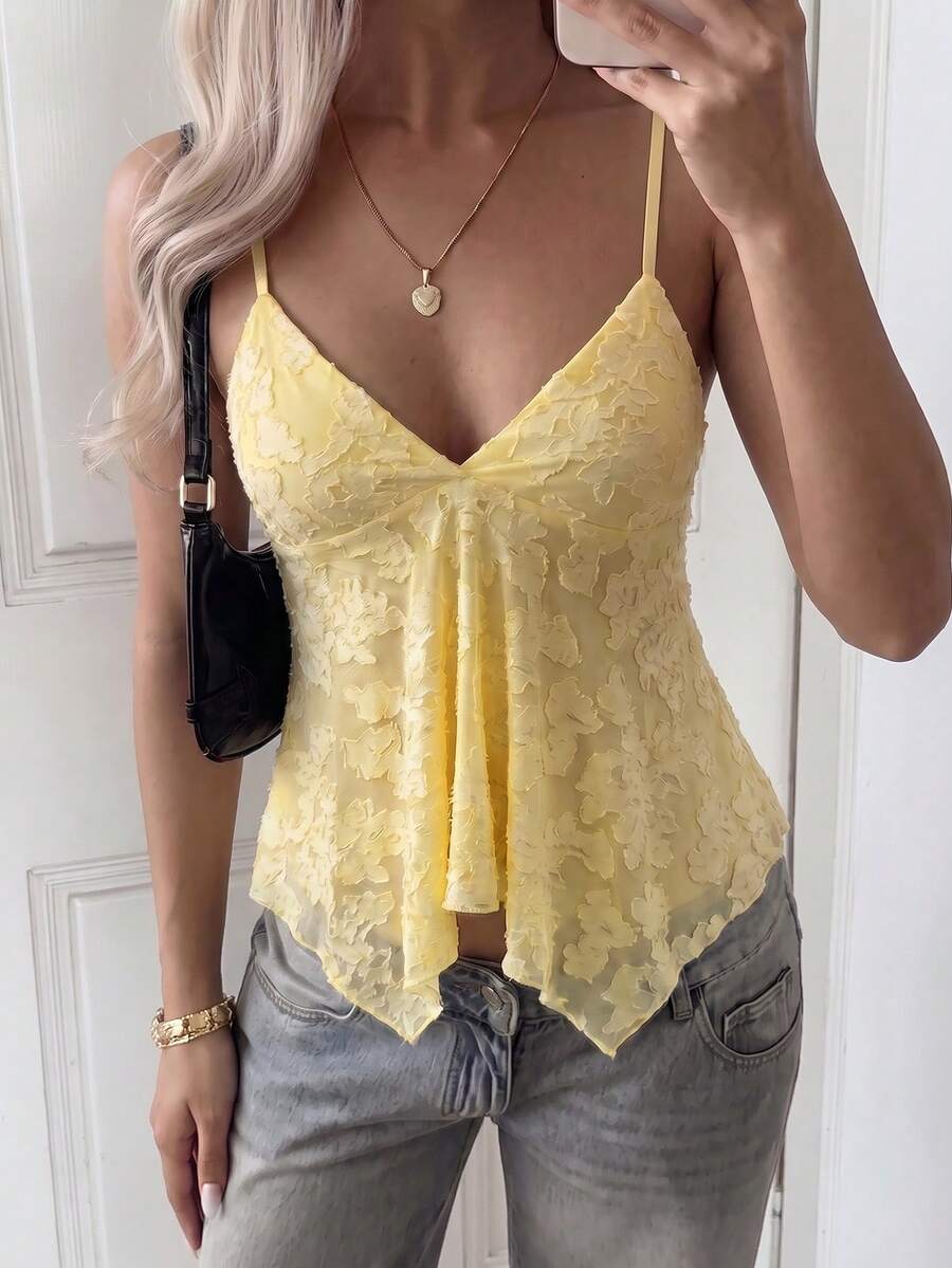 Women's white deep V-neck lace cami top featuring thin straps, semi-sheer lace fabric, and an asymmetrical hemline.