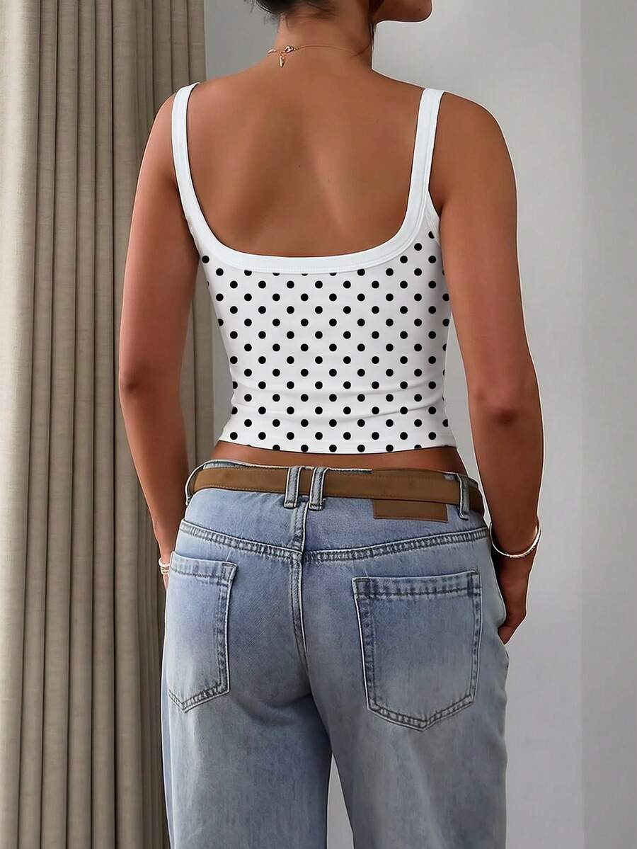 A slim fit women's crop cami tank top with spaghetti straps and a solid color design, made from comfortable stretch knitted fabric.