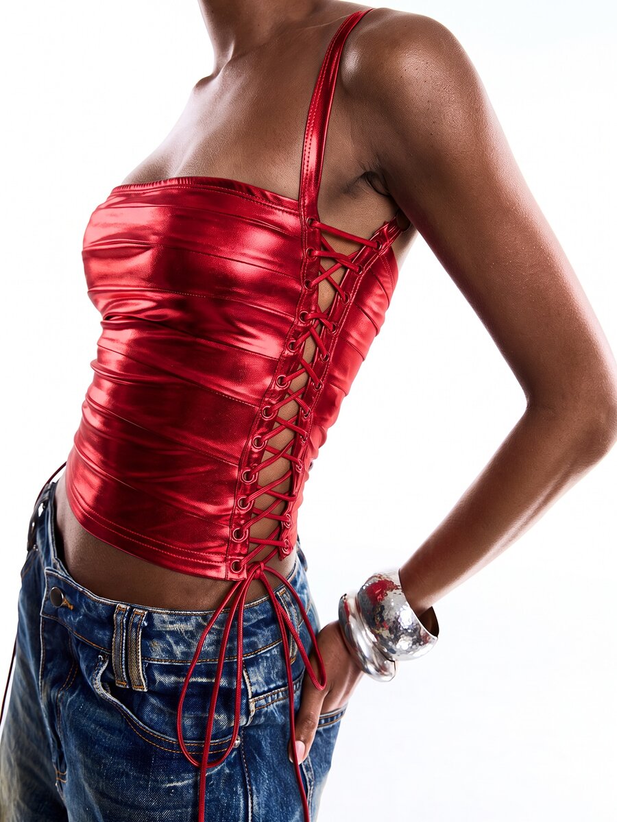 Black PU leather cropped camisole top for women featuring spaghetti straps, side tie details, and a ruched slim fit.
