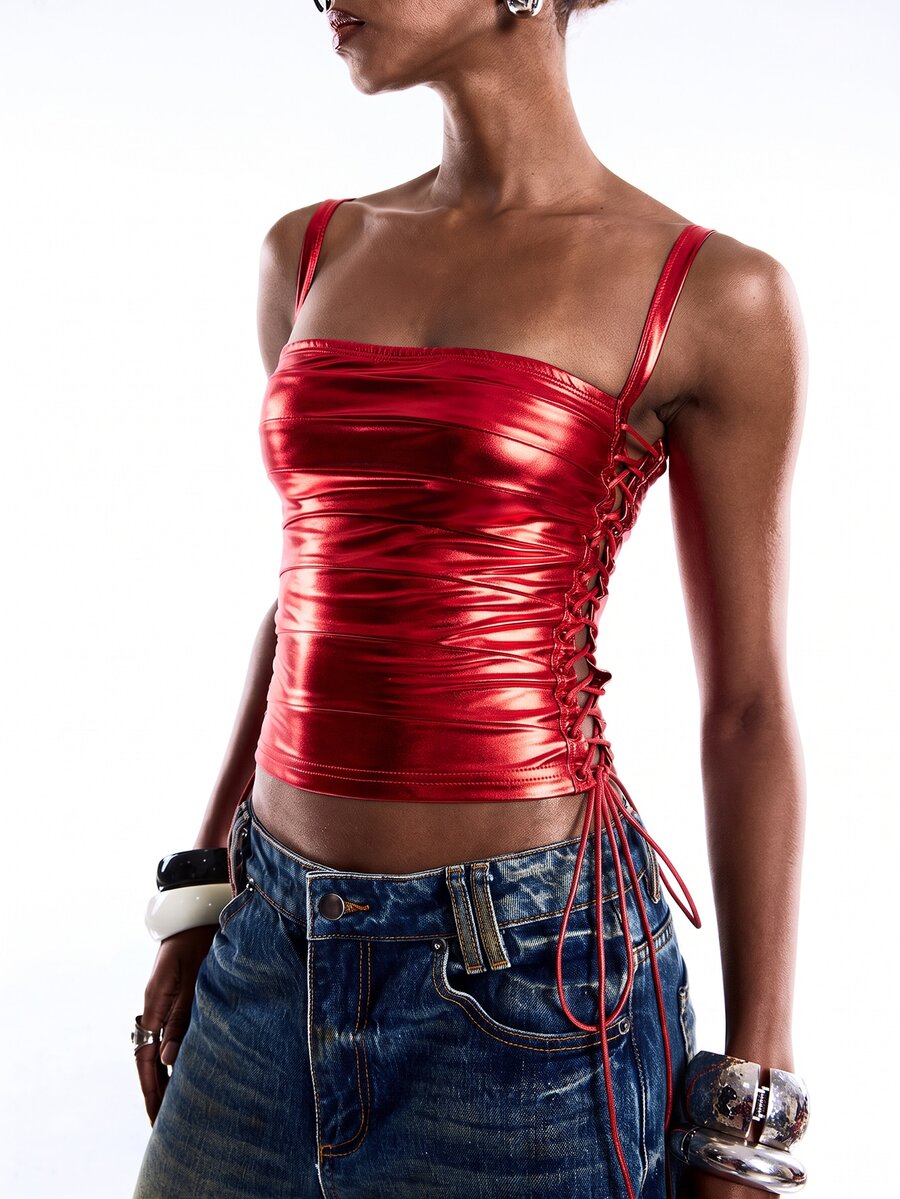 Black PU leather cropped camisole top for women featuring spaghetti straps, side tie details, and a ruched slim fit.