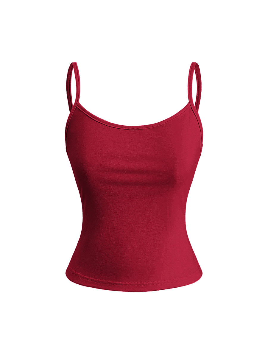 Woman wearing a black backless halter tank top with criss-cross details and textured knit fabric