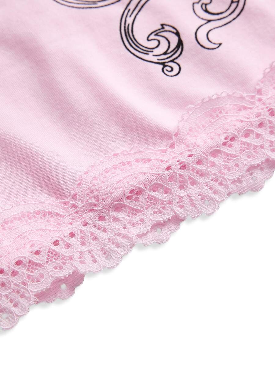 Women's pink crop cami top featuring rhinestone print, contrast lace trim, spaghetti straps, and slim fit cotton-blend fabric.