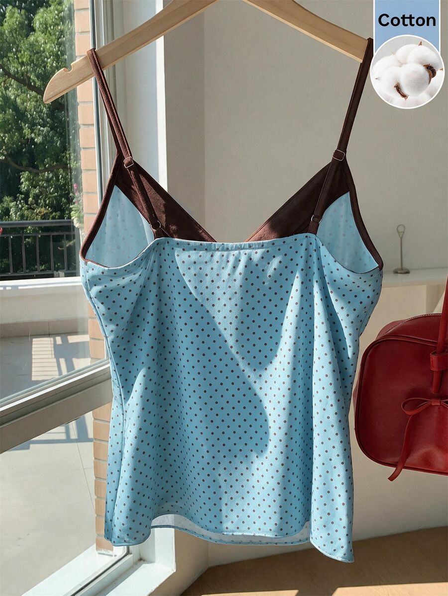 Black and white polka dot tie strap camisole top for women with thin spaghetti straps and slim fit.