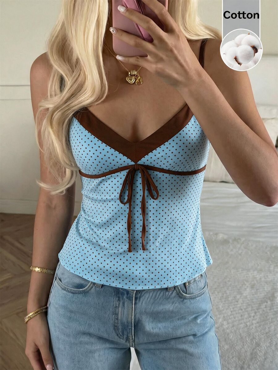 Black and white polka dot tie strap camisole top for women with thin spaghetti straps and slim fit.