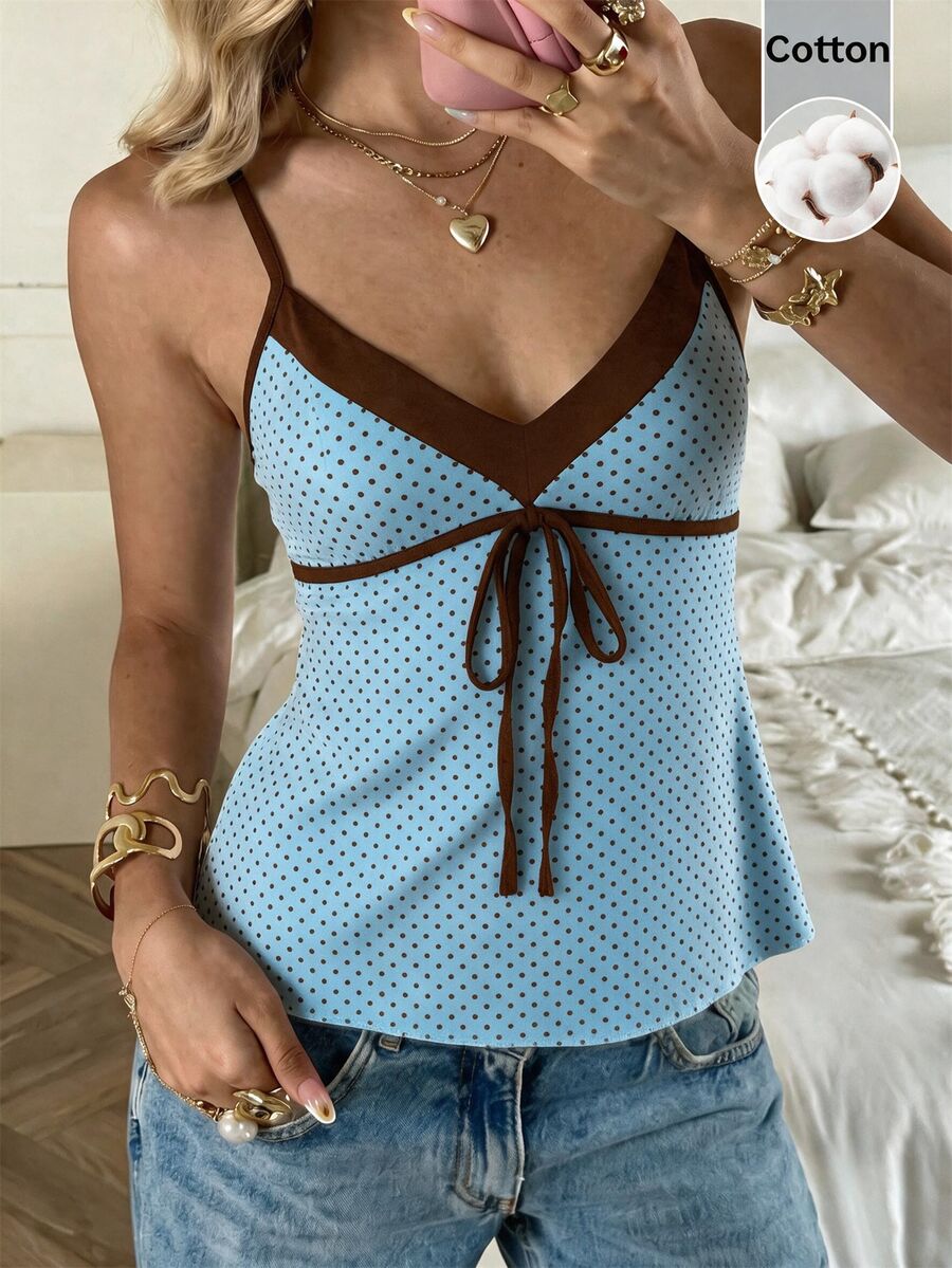 Black and white polka dot tie strap camisole top for women with thin spaghetti straps and slim fit.