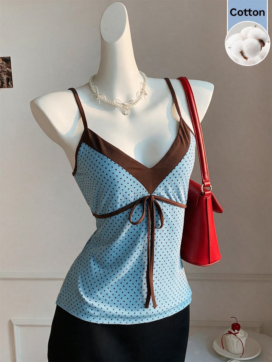 Black and white polka dot tie strap camisole top for women with thin spaghetti straps and slim fit.