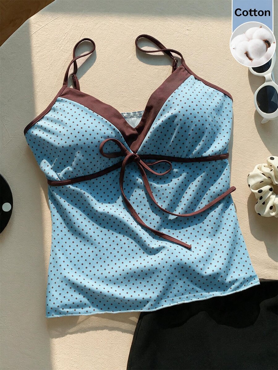 Black and white polka dot tie strap camisole top for women with thin spaghetti straps and slim fit.