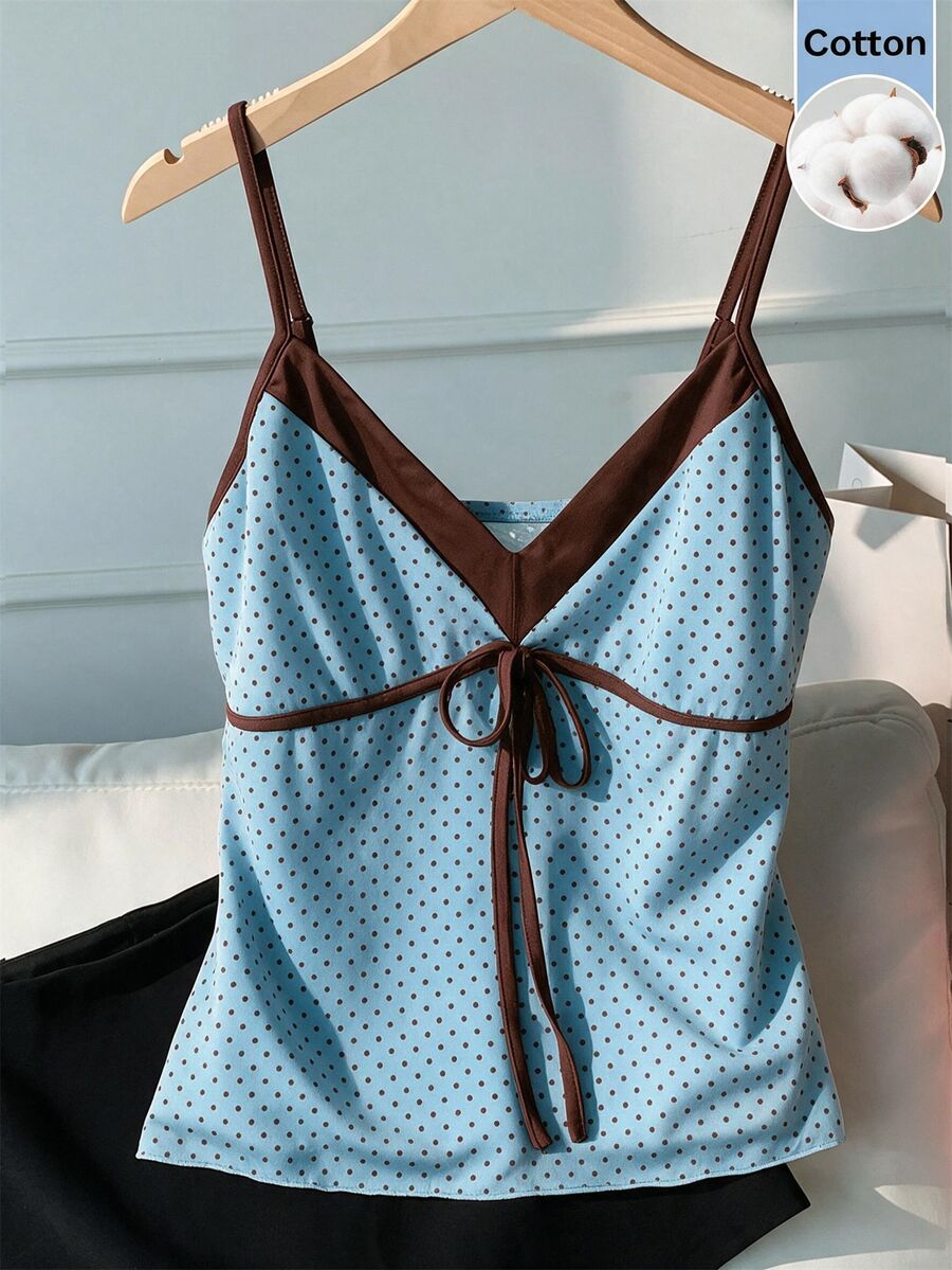 Black and white polka dot tie strap camisole top for women with thin spaghetti straps and slim fit.