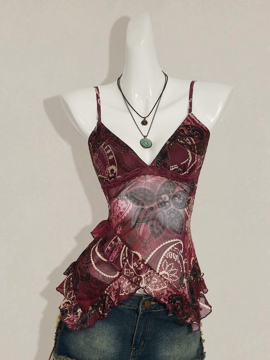 Women's burgundy floral graphic print mesh camisole top featuring an asymmetrical hem, backless cut, and spaghetti straps.
