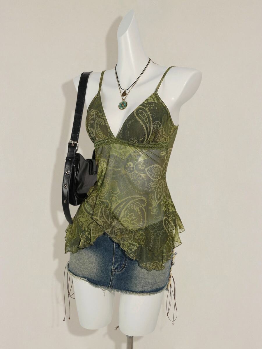 Women's burgundy floral graphic print mesh camisole top featuring an asymmetrical hem, backless cut, and spaghetti straps.