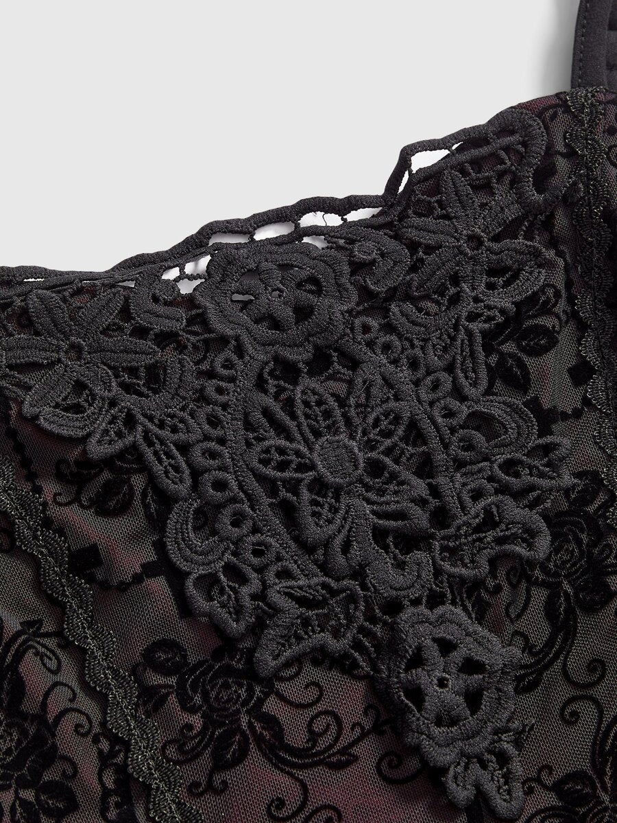 Black Gothic flocked lace camisole featuring spaghetti straps and an asymmetrical ruffle hem.