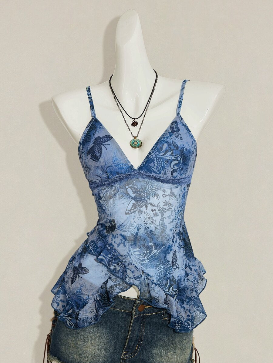 Women's burgundy floral graphic print mesh camisole top featuring an asymmetrical hem, backless cut, and spaghetti straps.