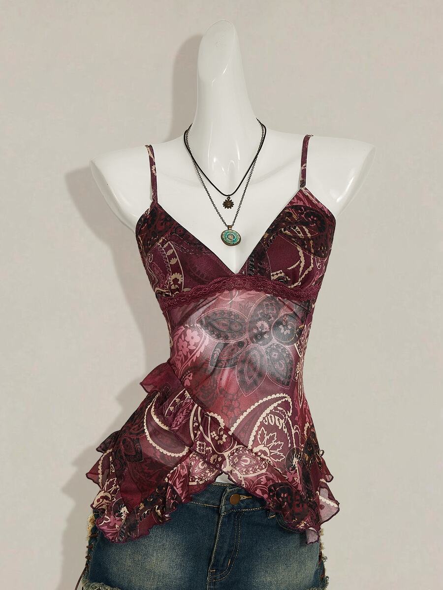 Women's burgundy floral graphic print mesh camisole top featuring an asymmetrical hem, backless cut, and spaghetti straps.