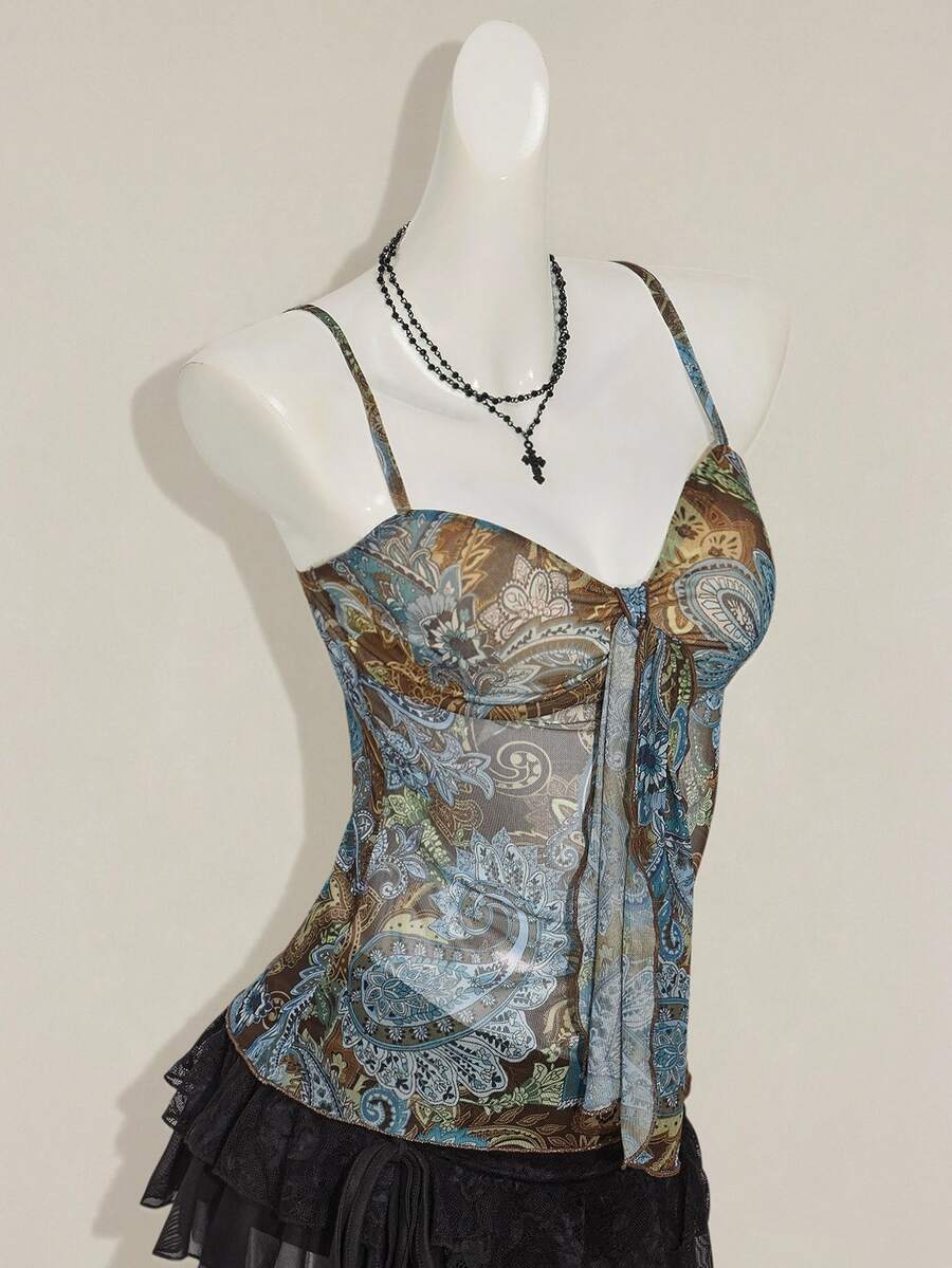 Burgundy paisley print ruched cami top for women featuring thin spaghetti straps, asymmetrical lace-up detail, and a slim fit.