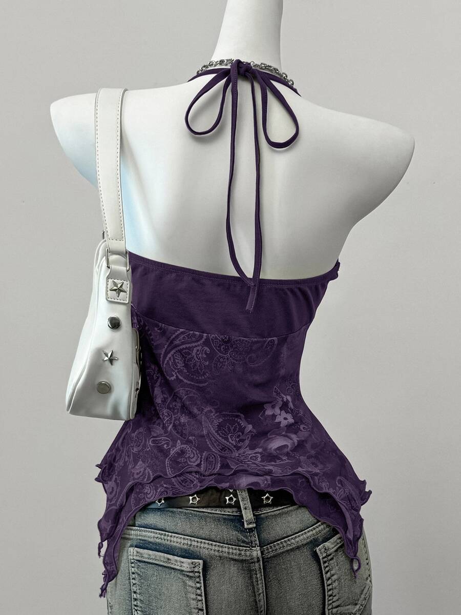 Women's backless halter cami top featuring a paisley print, sleeveless design, and an asymmetrical hem in knitted fabric.