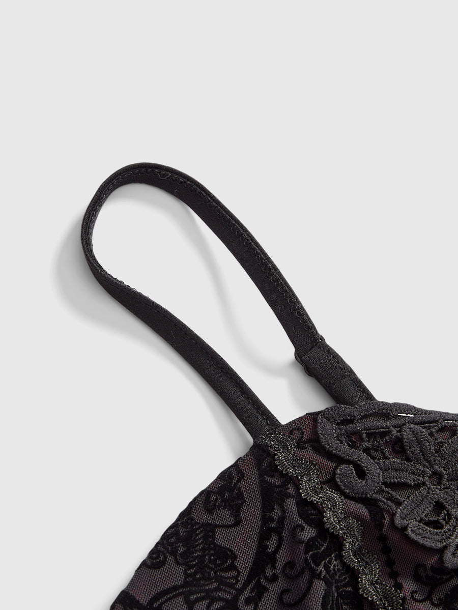 Black Gothic flocked lace camisole featuring spaghetti straps and an asymmetrical ruffle hem.