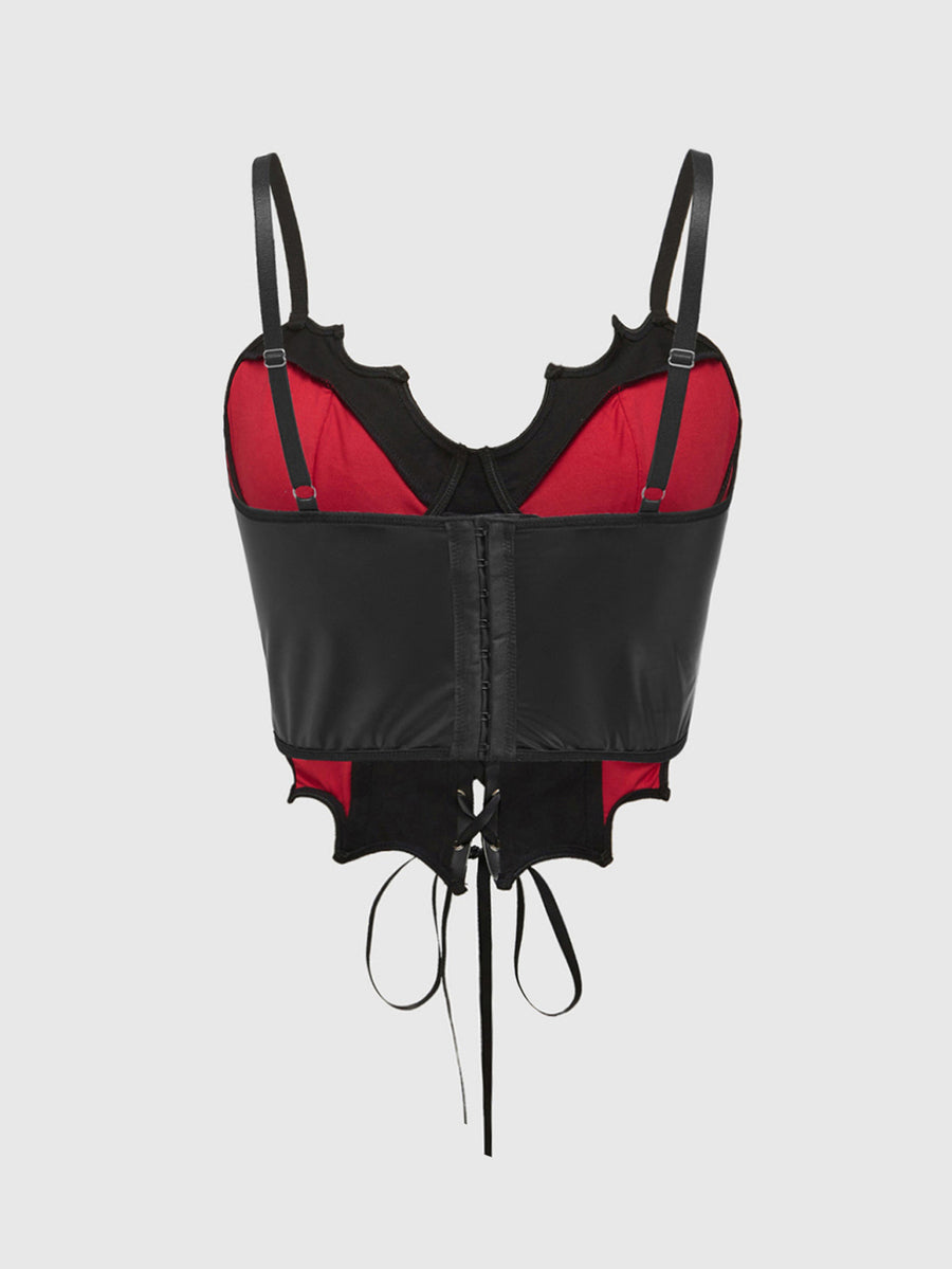 A women's black and red contrast corset tank top featuring spiderweb lace trim, a bat-shaped asymmetrical hem, spaghetti straps, and a grommet lace-up front.