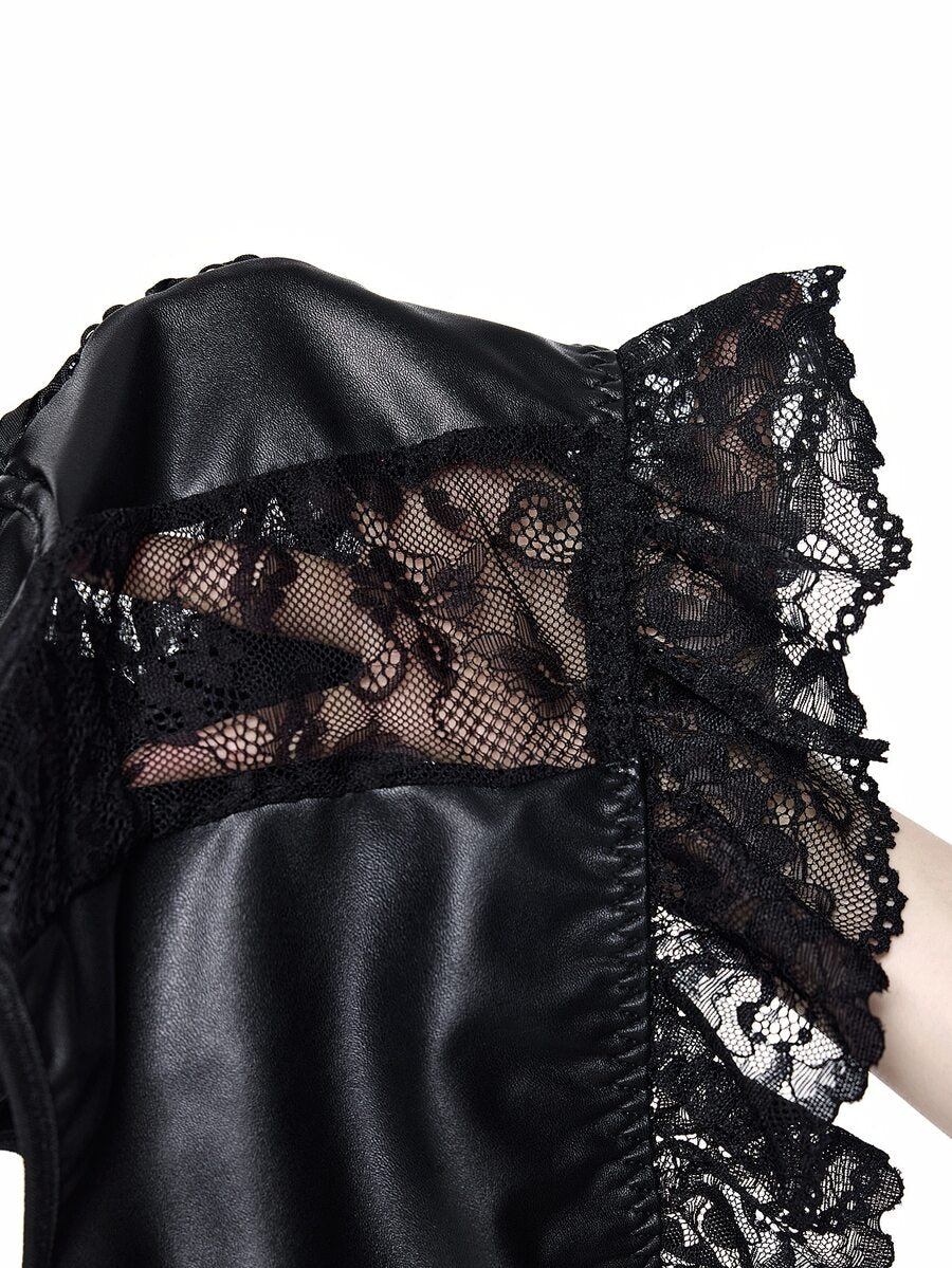 Woman wearing a black gothic micro crop camisole top featuring contrast lace trim, front lace-up detail, ruffle hem, and spaghetti straps.