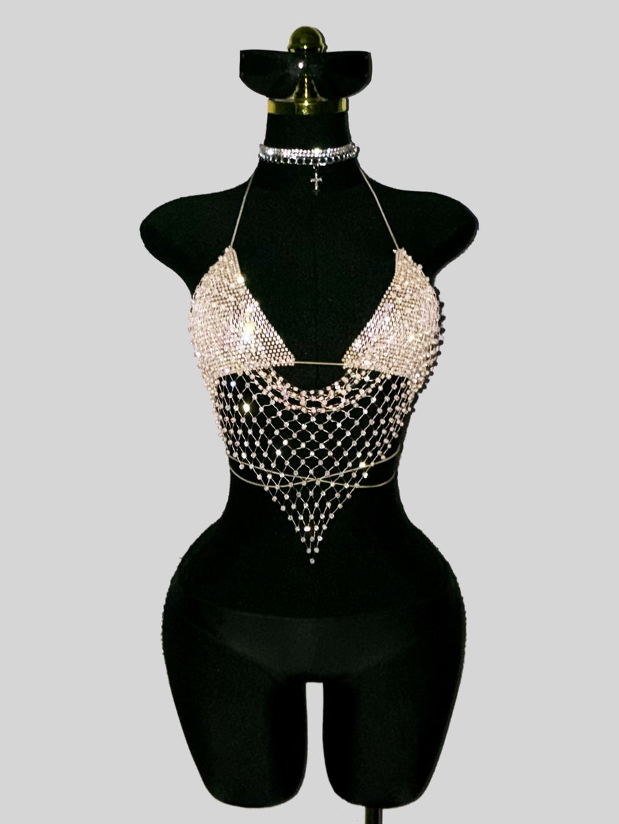 Black sheer mesh halter top for women featuring rhinestone glitter effect, backless design, chain details, and an asymmetrical hem.
