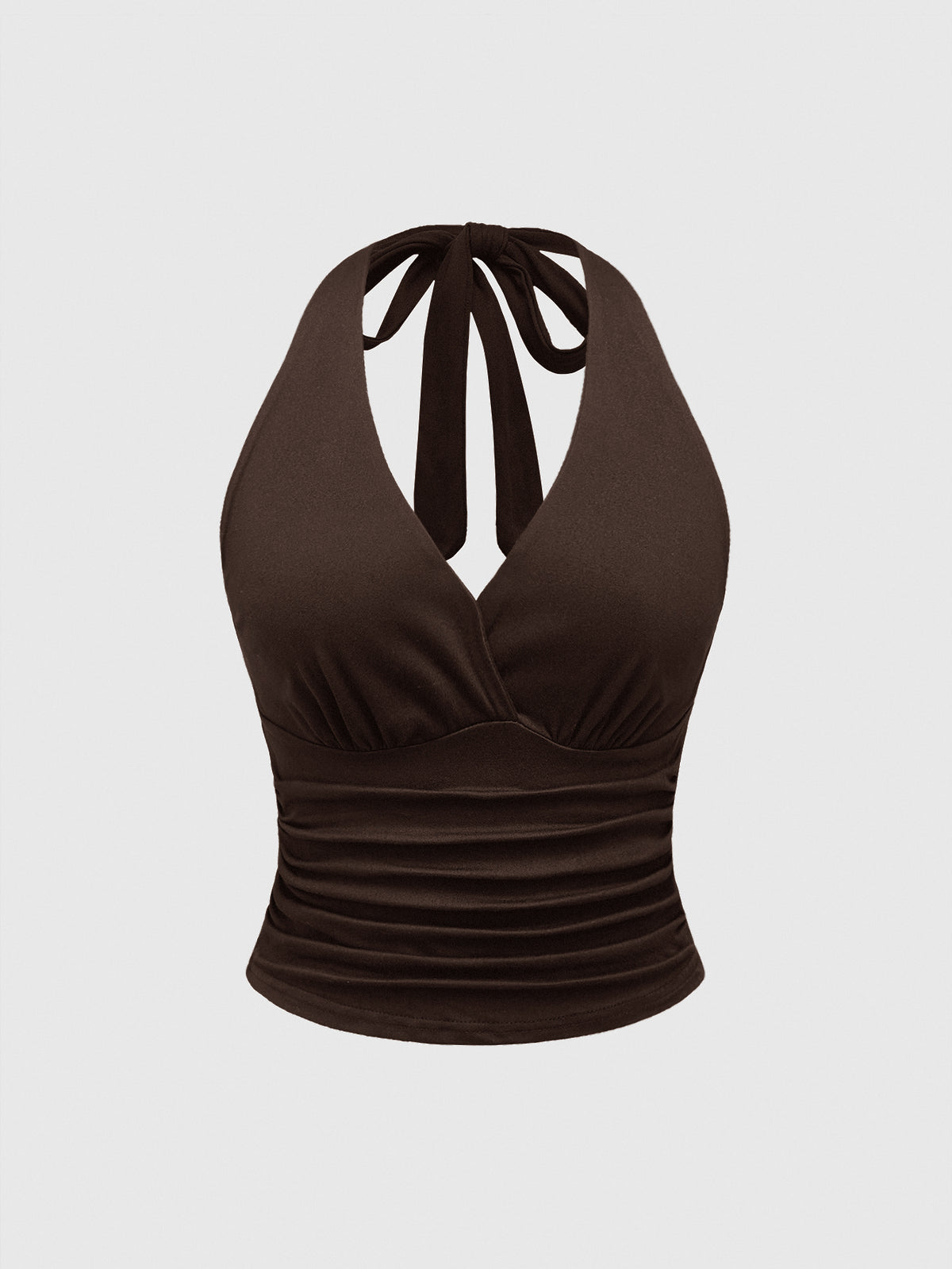 Women's halter crop tank top featuring a backless silhouette and ruched detailing in a slim fit design.