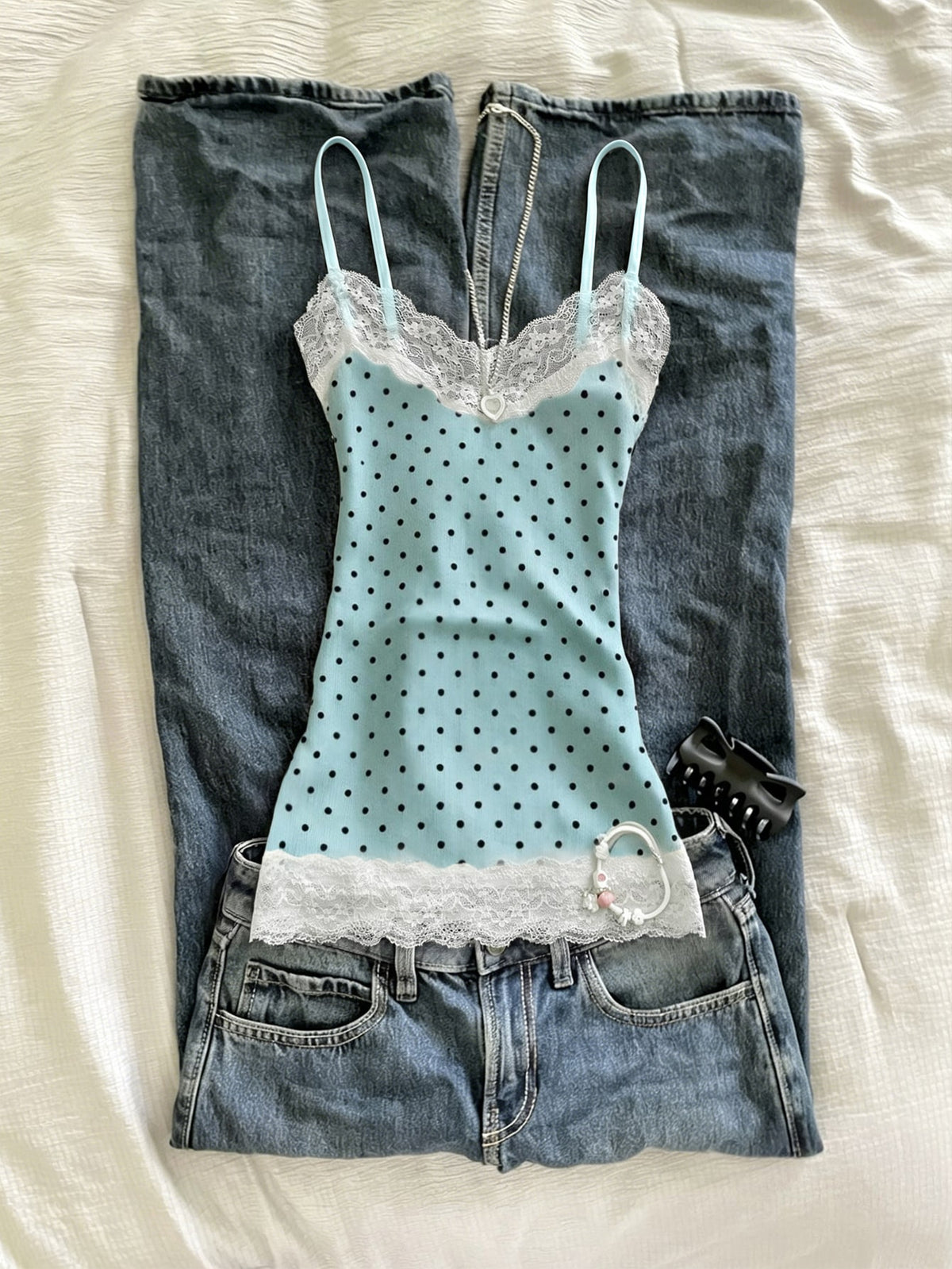 Women's solid color slim fit camisole top featuring delicate lace patchwork embroidery and tank straps.