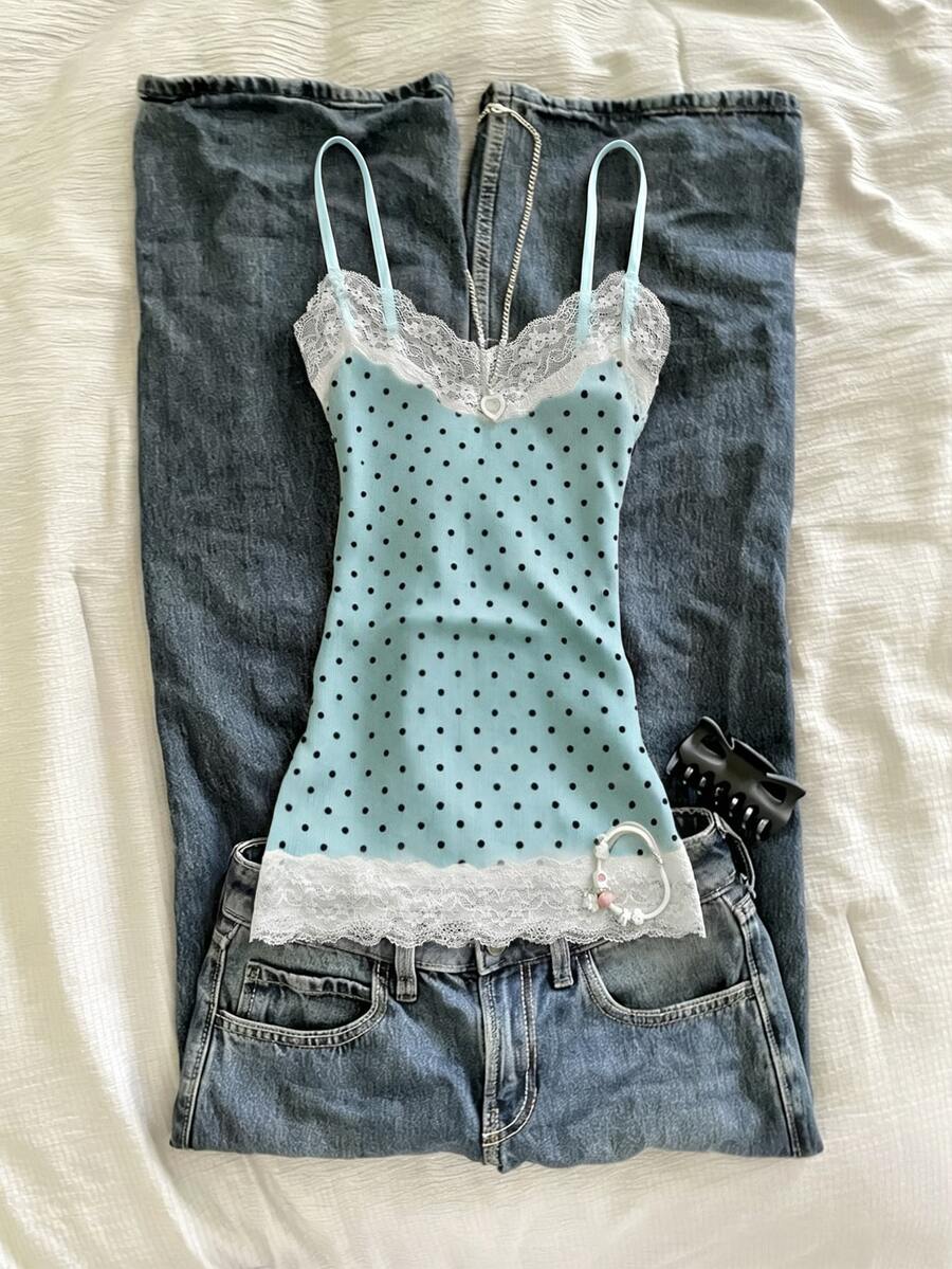 Women's solid color slim fit camisole top featuring delicate lace patchwork embroidery and tank straps.