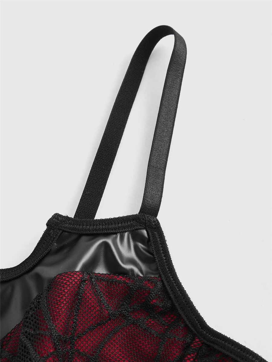 A women's black and red contrast corset tank top featuring spiderweb lace trim, a bat-shaped asymmetrical hem, spaghetti straps, and a grommet lace-up front.