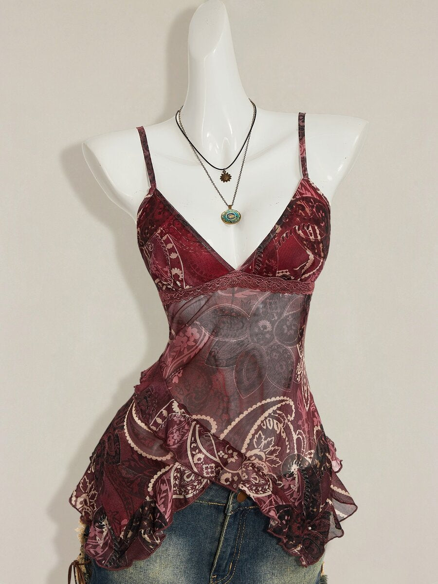 Women's burgundy floral graphic print mesh camisole top featuring an asymmetrical hem, backless cut, and spaghetti straps.