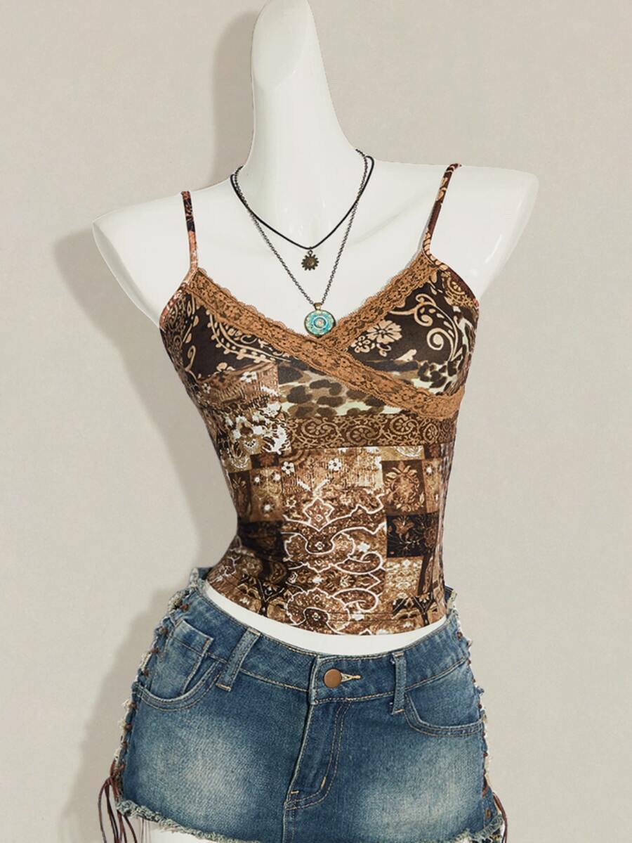 Women's blue fitted camisole top with contrast lace patchwork print, backless asymmetrical hem, and spaghetti straps.