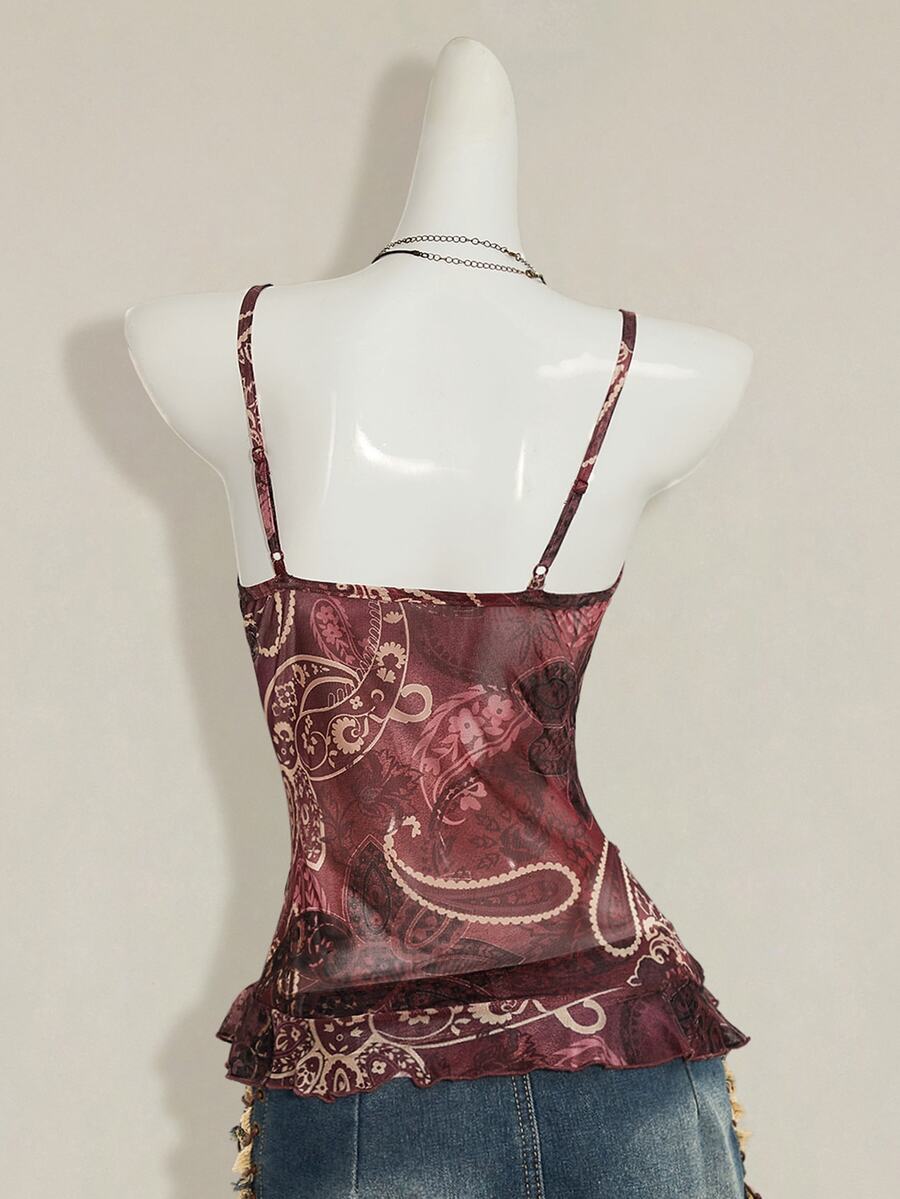 Women's burgundy floral graphic print mesh camisole top featuring an asymmetrical hem, backless cut, and spaghetti straps.