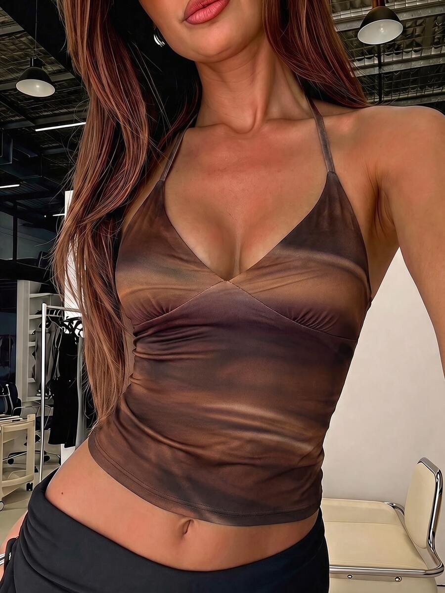 Women's black faux leather backless cami top with spaghetti straps and lace-up shirred sides.