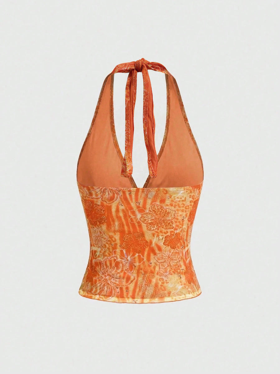 Women's pink tropical hibiscus print halter top featuring contrast lace trim and a slim fit silhouette.