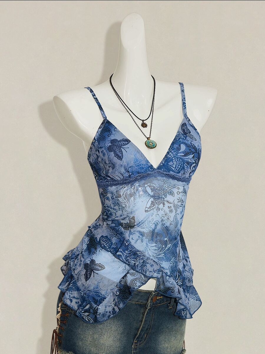 Women's burgundy floral graphic print mesh camisole top featuring an asymmetrical hem, backless cut, and spaghetti straps.