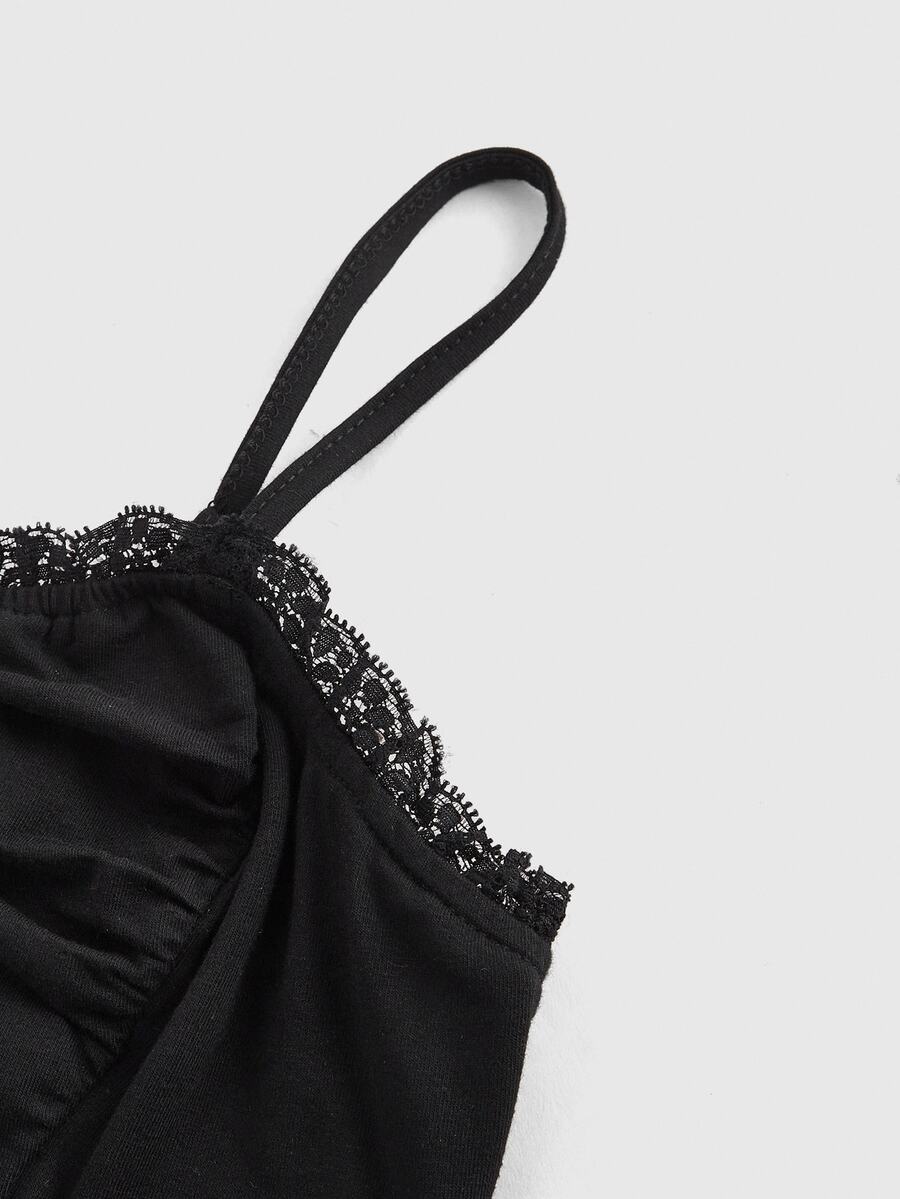 A black gothic slim-fit tank top featuring contrast lace patchwork detailing, ruched frill trim, and thin spaghetti straps made from soft knitted stretch fabric.