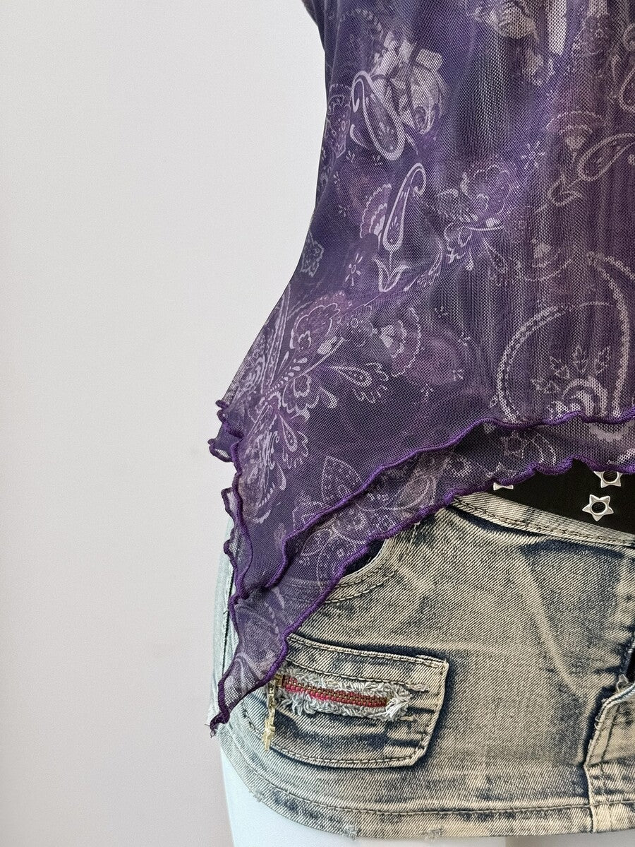 Women's backless halter cami top featuring a paisley print, sleeveless design, and an asymmetrical hem in knitted fabric.