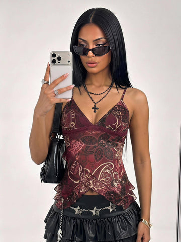 Women's burgundy floral graphic print mesh camisole top featuring an asymmetrical hem, backless cut, and spaghetti straps.