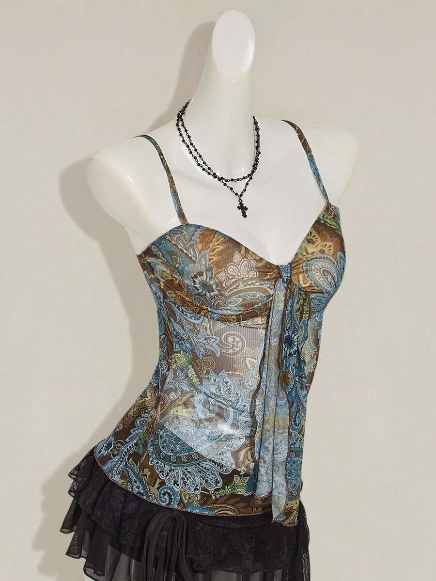 Burgundy paisley print ruched cami top for women featuring thin spaghetti straps, asymmetrical lace-up detail, and a slim fit.