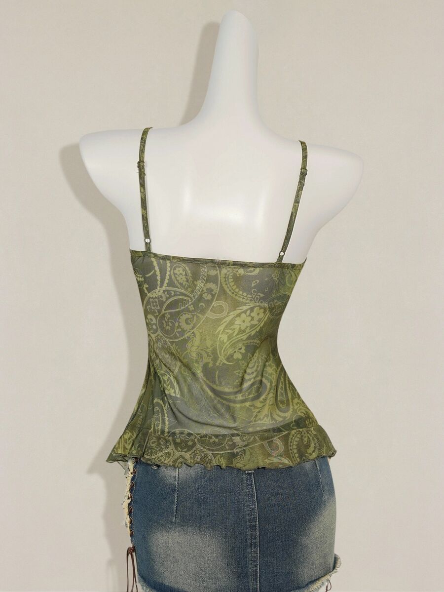 Women's burgundy floral graphic print mesh camisole top featuring an asymmetrical hem, backless cut, and spaghetti straps.
