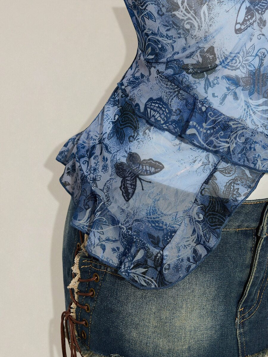 Women's burgundy floral graphic print mesh camisole top featuring an asymmetrical hem, backless cut, and spaghetti straps.