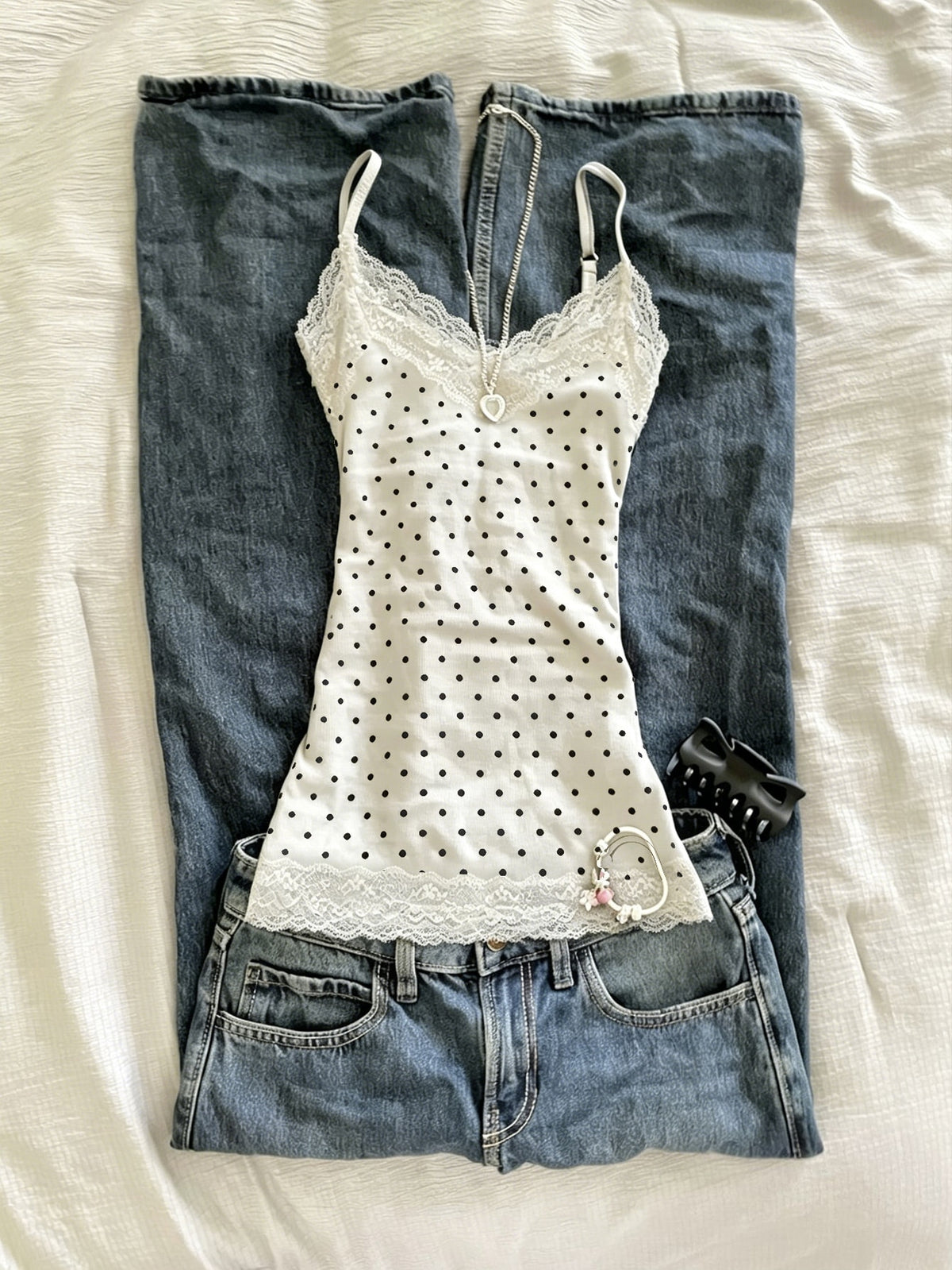 Women's solid color slim fit camisole top featuring delicate lace patchwork embroidery and tank straps.
