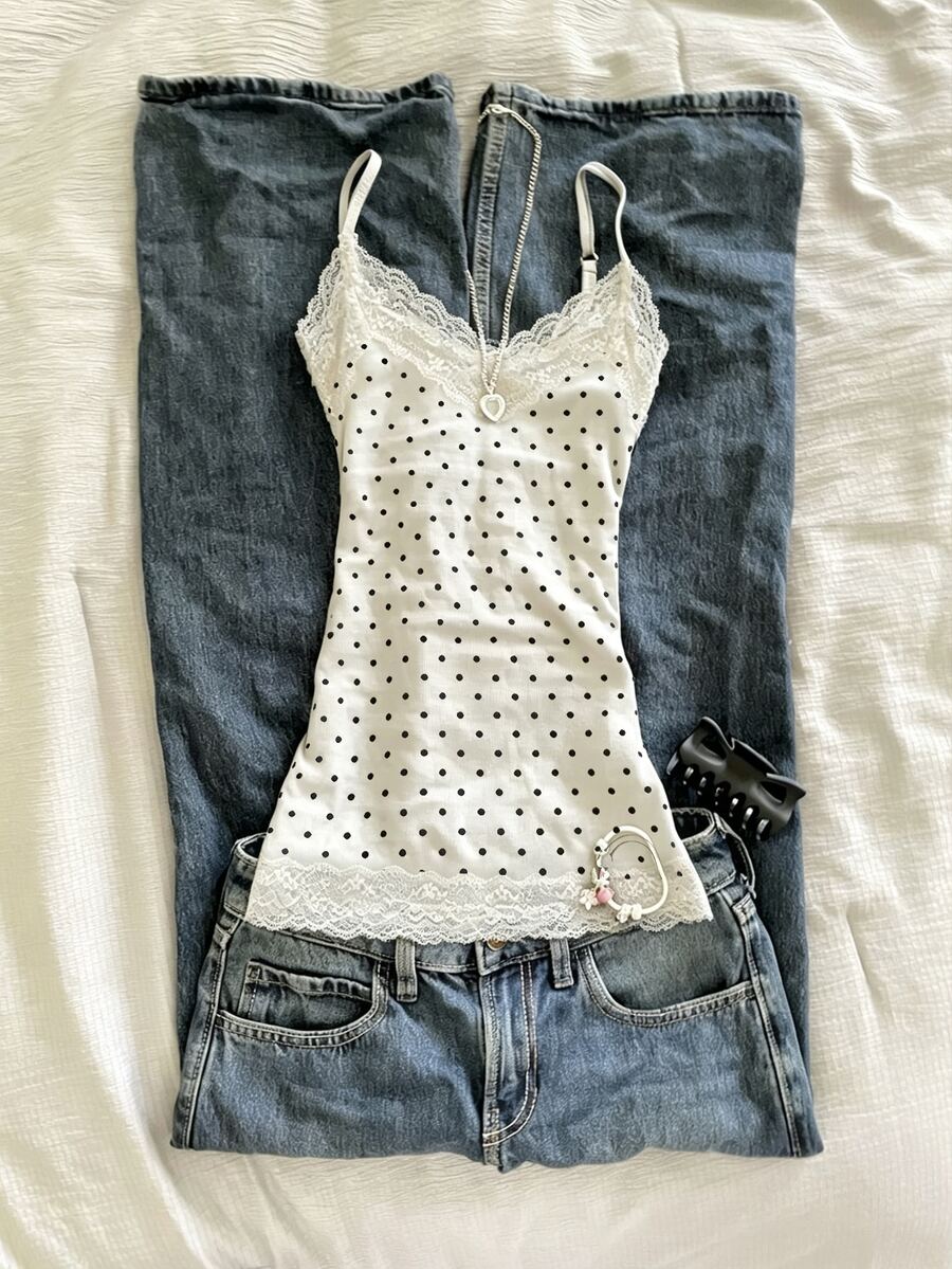 Women's solid color slim fit camisole top featuring delicate lace patchwork embroidery and tank straps.