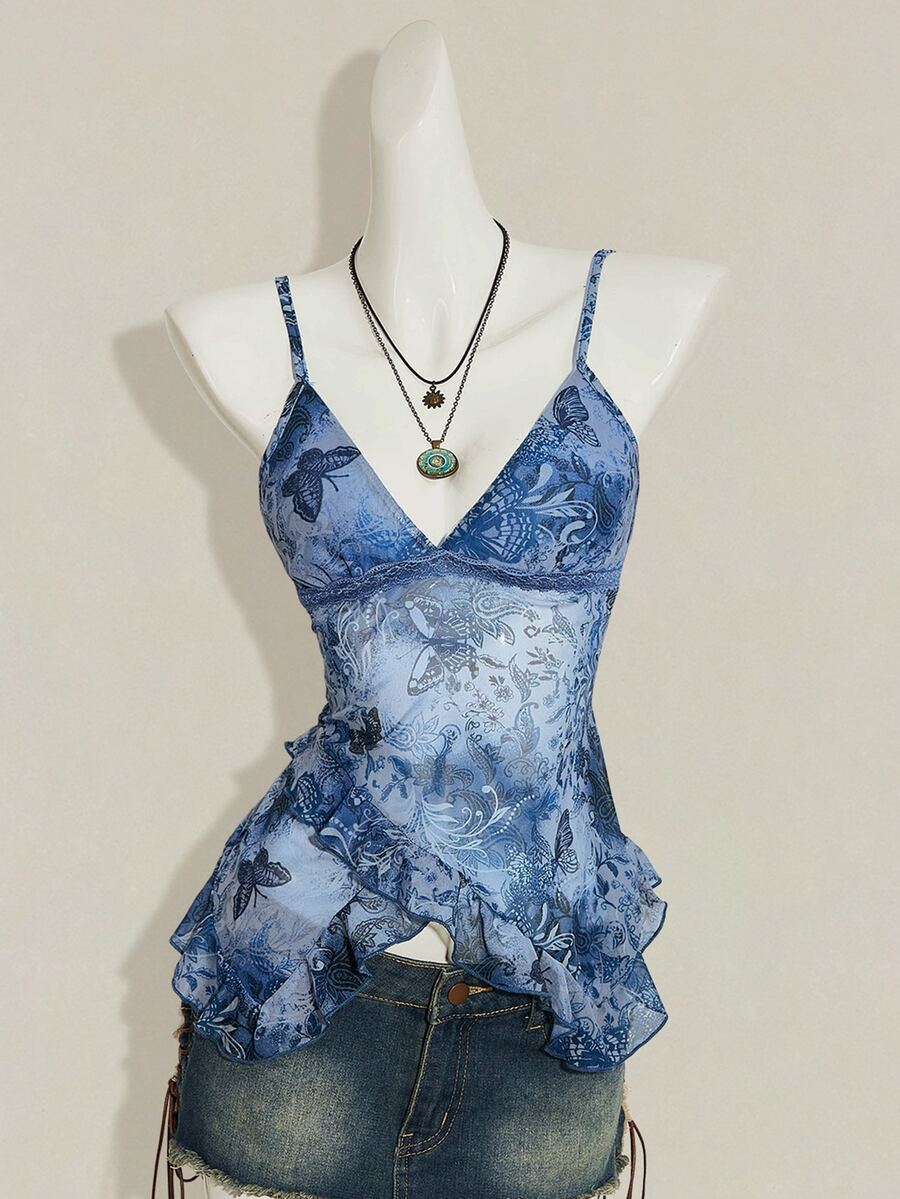 Women's burgundy floral graphic print mesh camisole top featuring an asymmetrical hem, backless cut, and spaghetti straps.