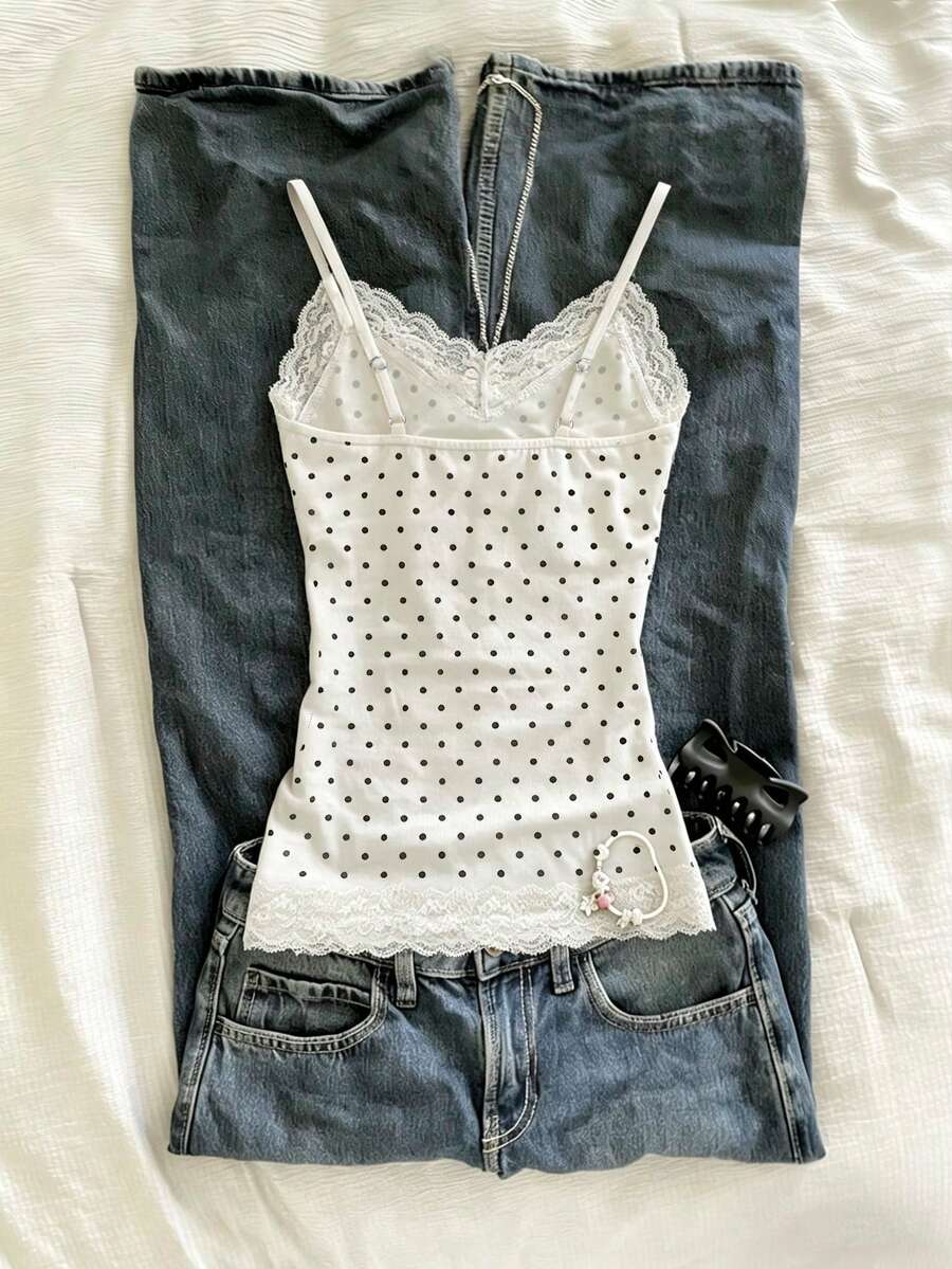 Women's solid color slim fit camisole top featuring delicate lace patchwork embroidery and tank straps.