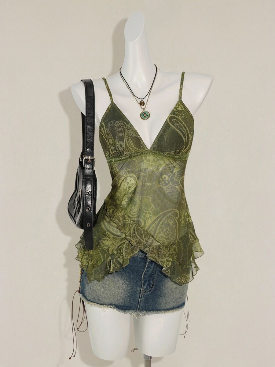 Women's burgundy floral graphic print mesh camisole top featuring an asymmetrical hem, backless cut, and spaghetti straps.