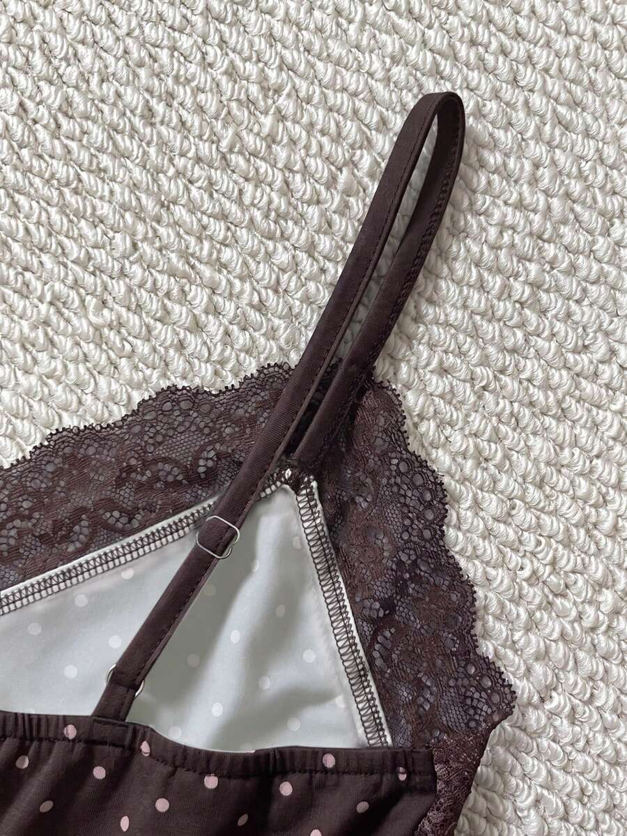 Women's solid color slim fit camisole top featuring delicate lace patchwork embroidery and tank straps.