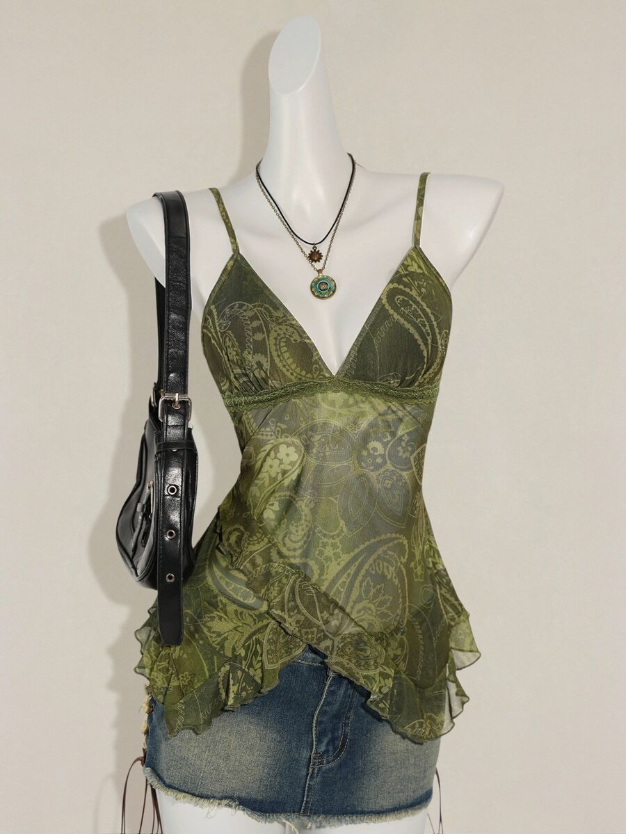 Women's burgundy floral graphic print mesh camisole top featuring an asymmetrical hem, backless cut, and spaghetti straps.