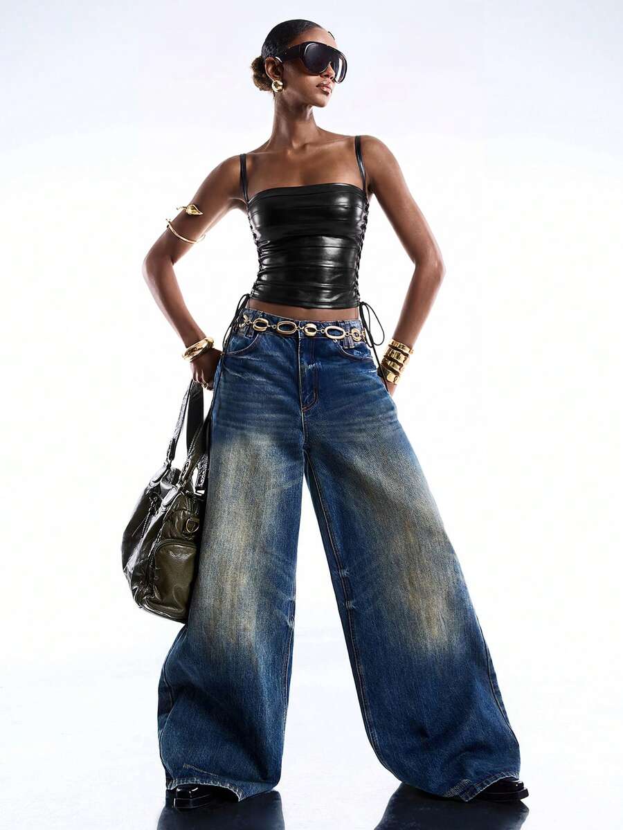 Black PU leather cropped camisole top for women featuring spaghetti straps, side tie details, and a ruched slim fit.