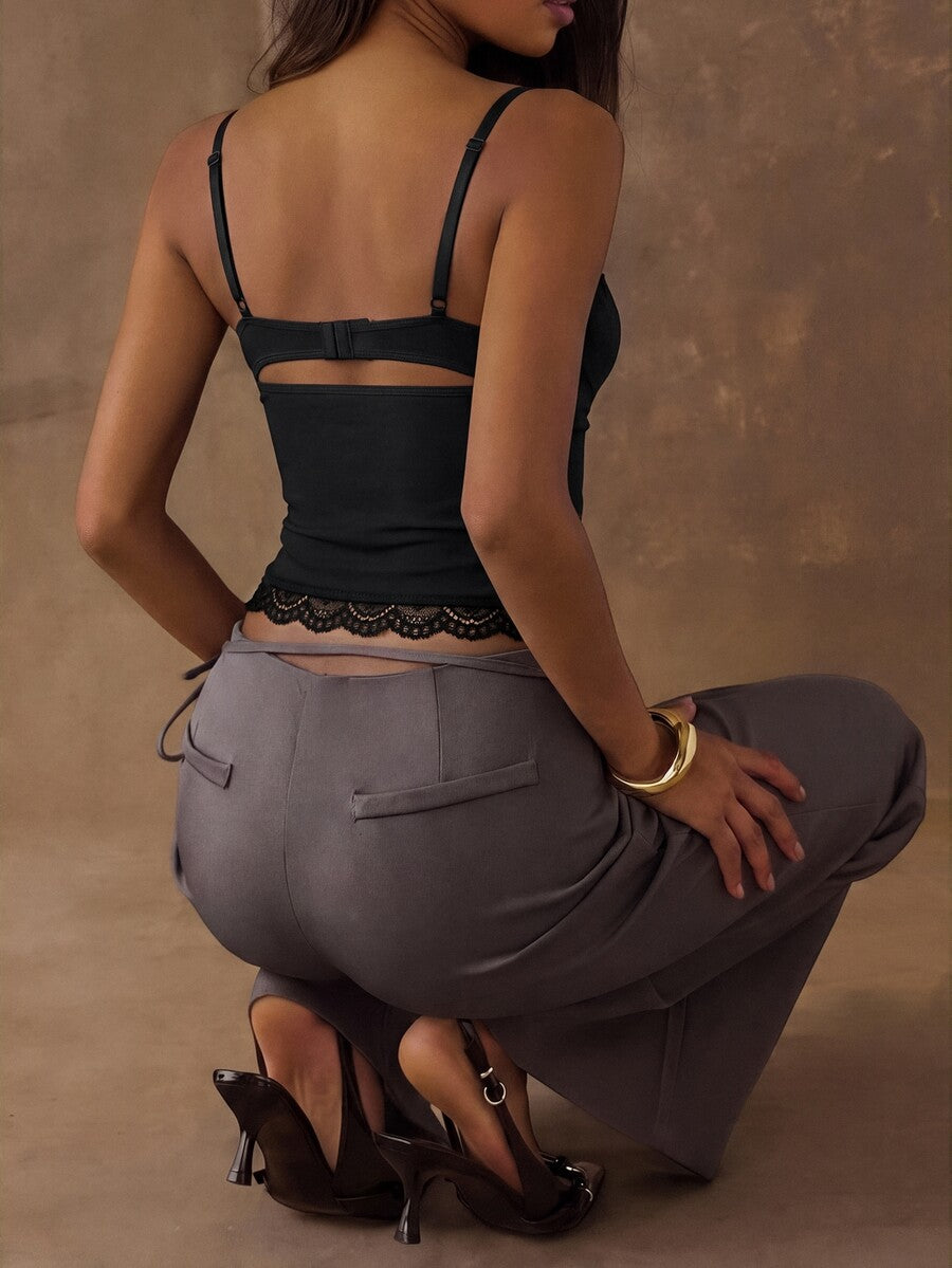 A black slim fit cropped camisole top featuring lace patchwork cup detail, spaghetti straps, and matching arm sleeves.
