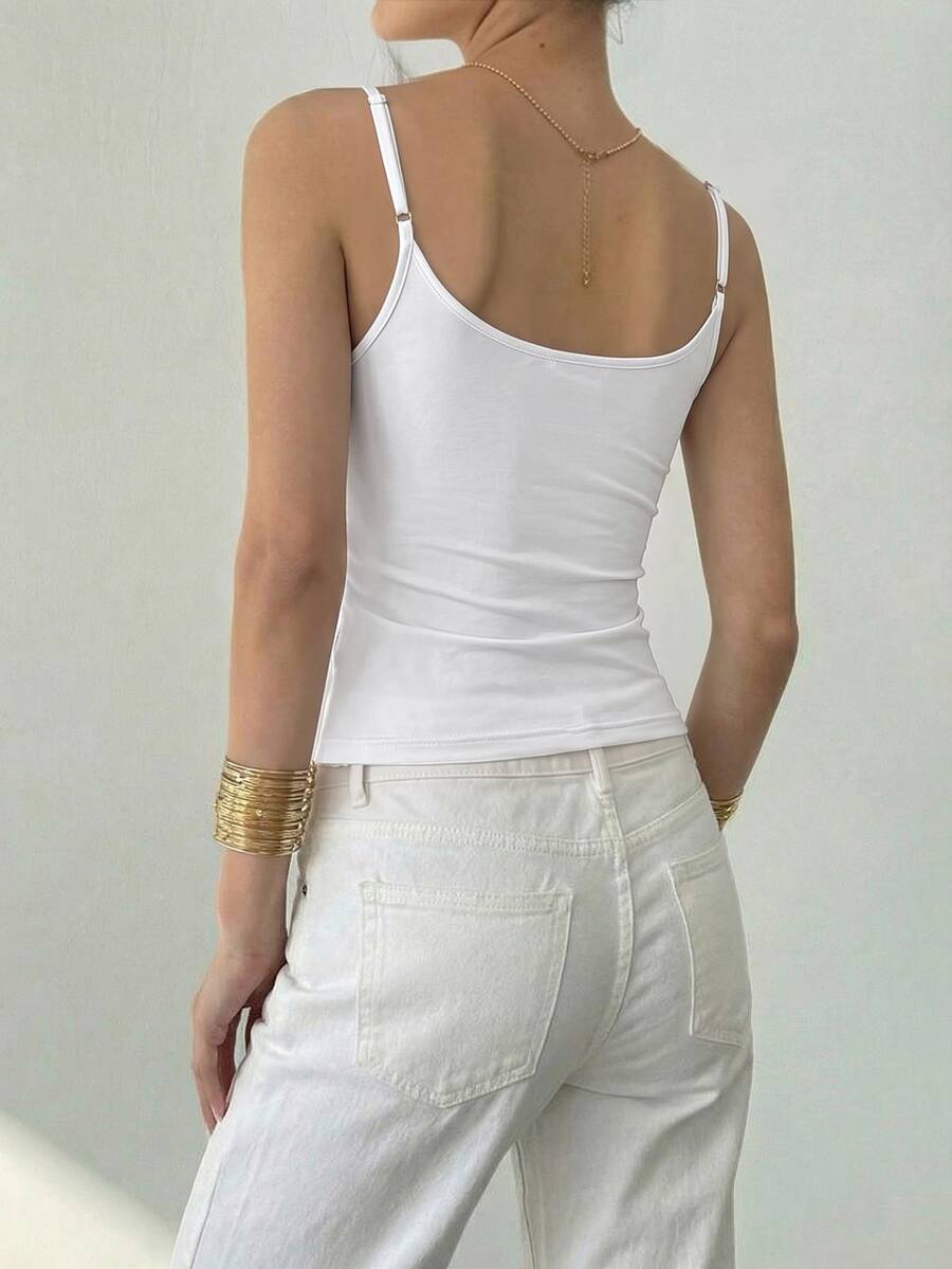 Women's sequin camisole top with spaghetti straps and a 3D rose embellishment