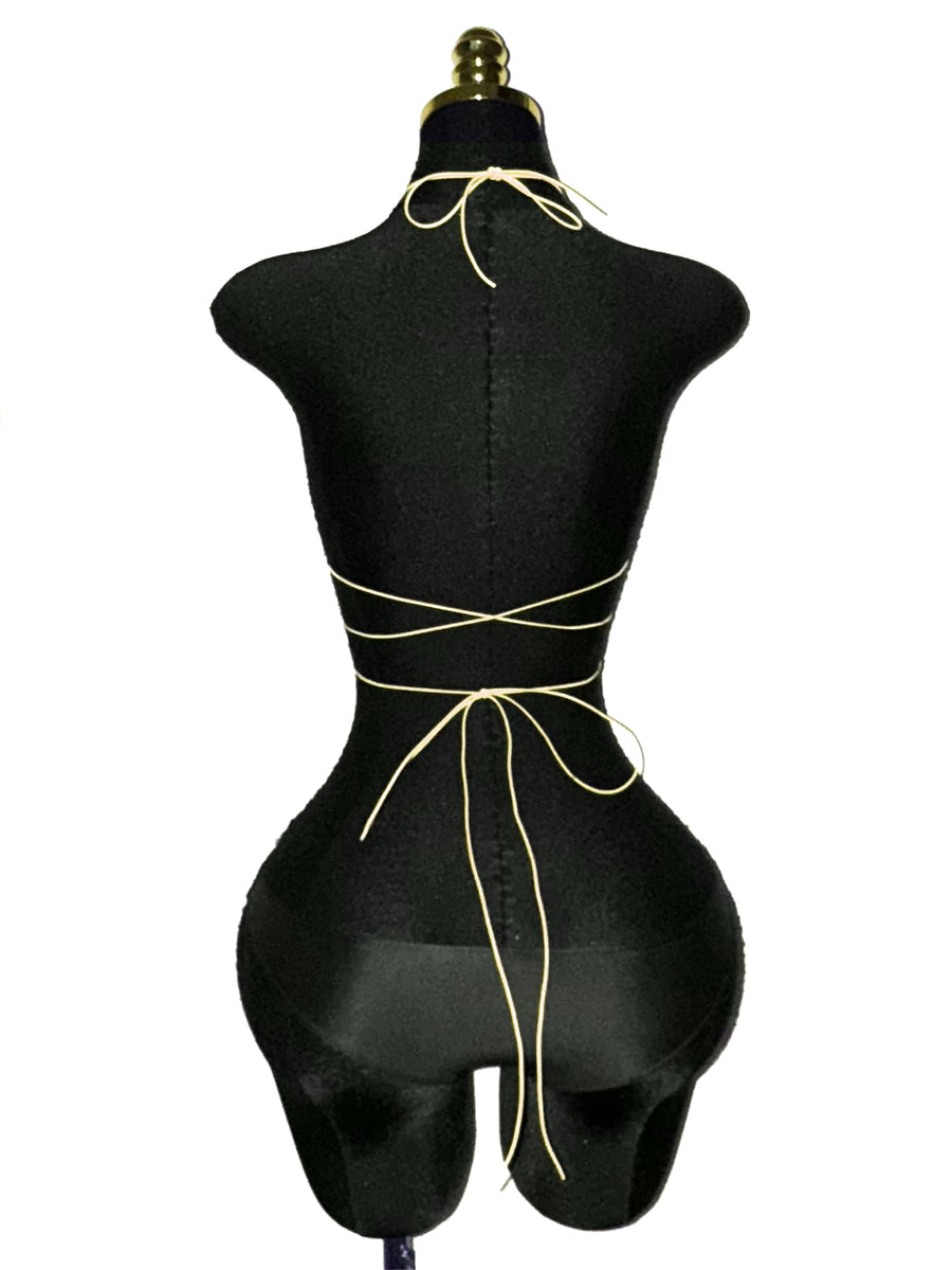 Black sheer mesh halter top for women featuring rhinestone glitter effect, backless design, chain details, and an asymmetrical hem.